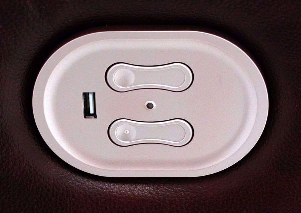 Close Up of Power Activation Buttons and USB Charging Port on the Dark Brown Leather Catanzaro Reclining Loveseat by Ashley Furniture | Home Furniture + Mattress