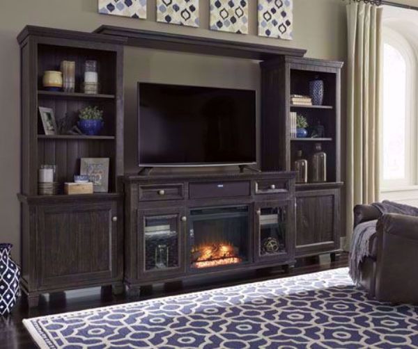 Dark Brown Townser Entertainment Center by Ashley in Room Setting with Fireplace in a Room Setting | Home Furniture Plus Bedding