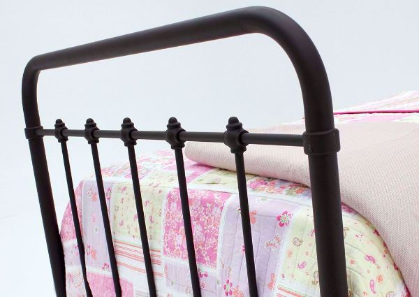 Brown Jourdan Creek Twin Iron Bed Showing the Footboard at an Angle | Home Furniture Plus Bedding