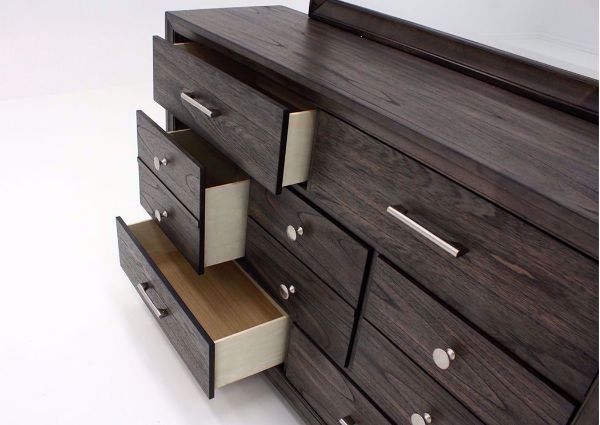Dark Brown Jaymes Dresser with Mirror Showing the Drawer Fronts at an Angle Open | Home Furniture Plus Mattress