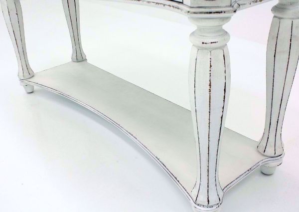 Distressed White Magnolia Manor Sofa/Console Table Showing the Lower Shelf | Home Furniture Plus Mattress