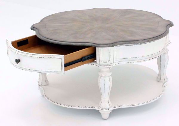Distressed White Magnolia Manor Round Coffee Table at an Angle With the Drawer Open | Home Furniture Plus Bedding