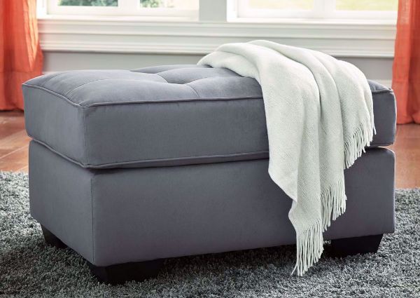 Steel Gray Filone Ottoman by Ashley Furniture In Room Setting | Home Furniture Plus Mattress