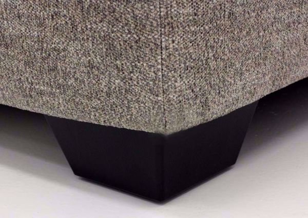 Close Up of the Block Style Feet on the Brown Upholstered Bovarian Storage Ottoman by Ashley Furniture | Home Furniture Plus Bedding