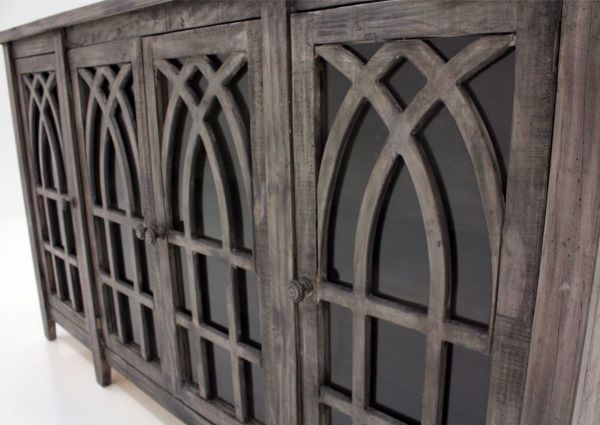 Distressed Gray Cathedral 4 Door Cabinet at an Angle Showing the Decorative Doors | Home Furniture Plus Bedding