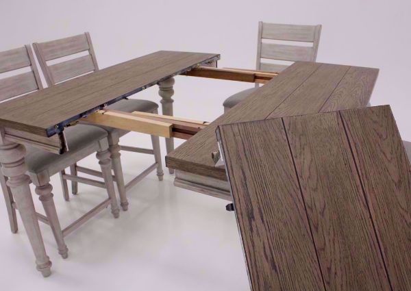 White Two-Tone Heartland 7 Piece Bar Height Table Set at an Angle With the Leaf Out and to the Side Close Up | Home Furniture Plus Mattress