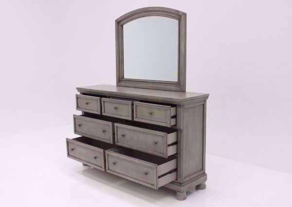 Distressed Light Gray Lettner Dresser with Mirror by Ashley Furniture at an Angle With the Drawers Open | Home Furniture Plus Bedding