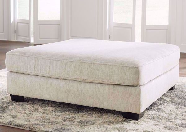 Off White Rawcliffe Accent Ottoman by Ashley Furniture in a Room Setting | Home Furniture Plus Mattress