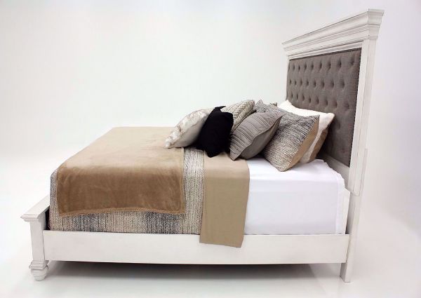 Distressed White Kanwyn Upholstered Queen Size Bed by Ashley Showing the Side View | Home Furniture Plus Mattress
