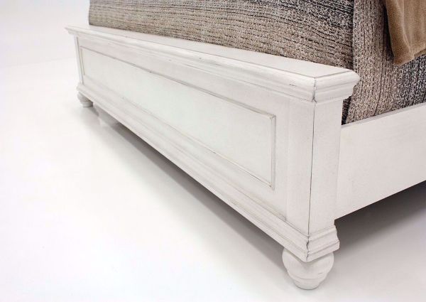 Distressed White Kanwyn Upholstered Queen Size Bed by Ashley Showing the Footboard Detail | Home Furniture Plus Mattress