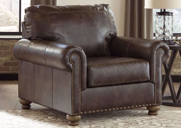 Nicorvo Chair in Room Setting by Ashley Covered in Brown Upholstery with Accent Pillows | Home Furniture Plus Bedding