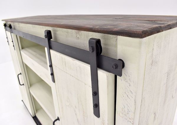 Distressed White Maverick TV Stand by Vintage Showing the Sliding Barn Door Details | Home Furniture Plus Bedding