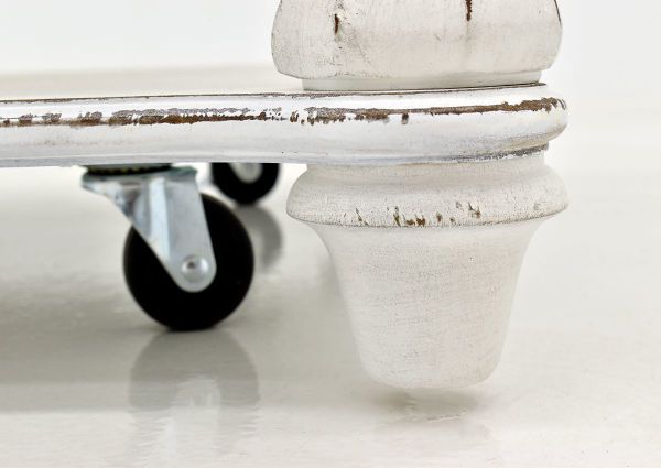 Close Up of the Casters and Foot on the White Magnolia Manor Rectangle Coffee Table | Home Furniture Plus Bedding