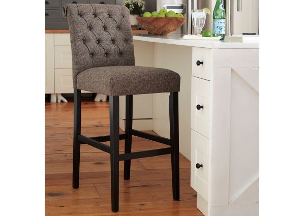 Warm Gray Tripton 30 Inch Upholstered Bar Stool by Ashley Showing the Room View | Home Furniture Plus Bedding