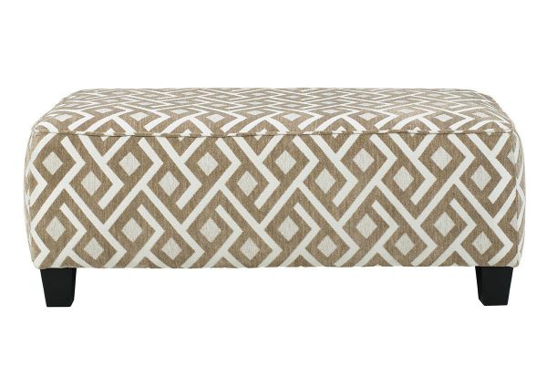Side View Dovemont Ottoman by Ashley Furniture with Patterned Upholstery in Tan and White | Home Furniture Plus Bedding