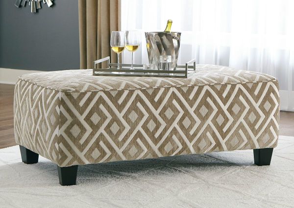 Room Shot of the Dovemont Ottoman by Ashley Furniture with Patterned Upholstery in Tan and White | Home Furniture Plus Bedding