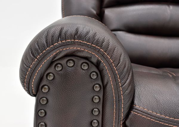 Close Up View of the Nailhead Trim on the Torino Glider Recliner in Brown by Man Wah | Home Furniture Plus Bedding