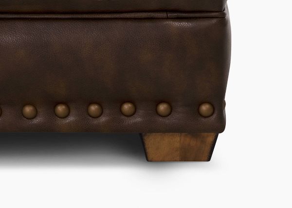 	Close Up View of the Foot and Nailhead Trim on the Tula Leather Chair in Brown by Franklin Industries | Home Furniture Plus Bedding